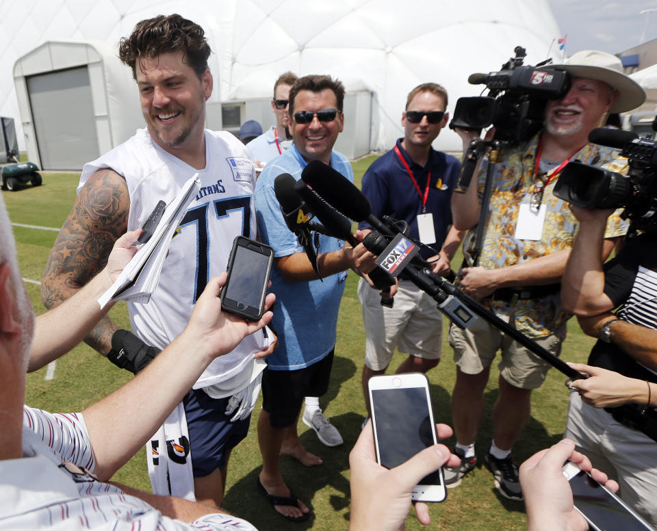 Tennessee Titans offensive tackle Taylor Lewan (77) answers questions following the first day of practice at NFL football training camp Thursday, July 26, 2018, in Nashville, Tenn. (AP Photo/Mark Humphrey)