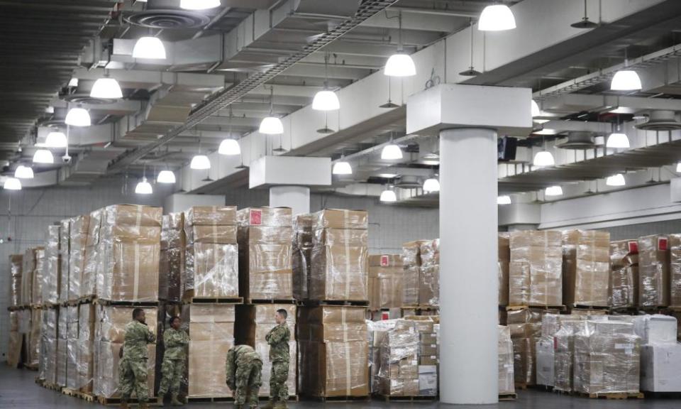 Crates of medical supplies at the Jacob Javits Center, in New York. Authorities say price gougers are stockpiling and selling off essential products.