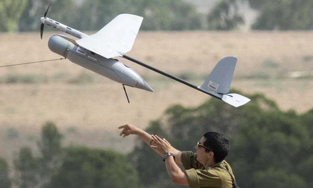 A soldier launches an Israeli army drone