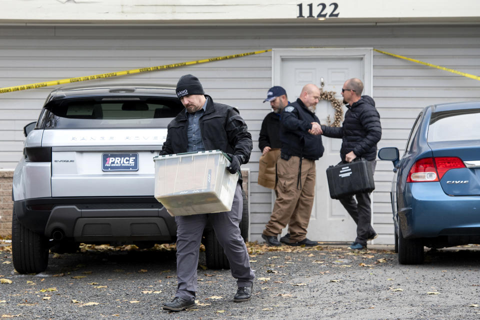 Officers investigate the deaths of four University of Idaho students at an apartment complex south of campus on Nov. 14, 2022, in Moscow, Idaho.  (Zach Wilkinson / The Moscow-Pullman Daily News via AP)