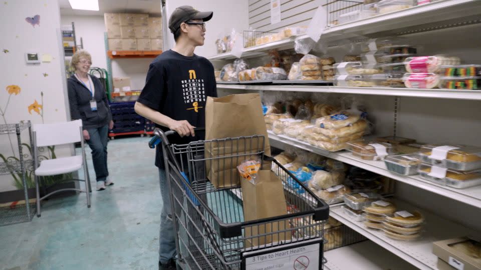 Khamphay Khen shops at the Enfield Food Shelf to help feed his family of six. - CNN