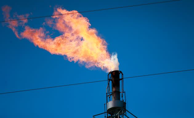 A chimney from a power plant is seen in Linden, New Jersey, on April 22, 2022.