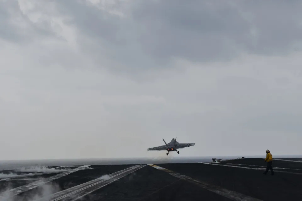 A fighter jet takes off from the USS Dwight D. Eisenhower.