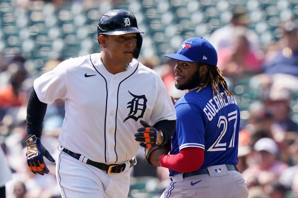 Toronto Blue Jays first baseman Vladimir Guerrero Jr. (27) looks back as Detroit Tigers designated hitter Miguel Cabrera heads back to the dugout after grounding out during the second inning of a baseball game, Sunday, Aug. 29, 2021, in Detroit.