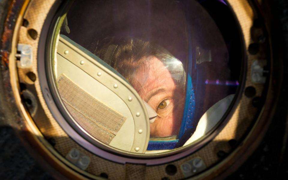 Expedition 27 Flight Engineer Cady Coleman peeks out of a window of the Soyuz TMA-20 spacecraft shortly after she and Commander Dmitry Kondratyev and Flight Engineer Paolo Nespoli landed southeast of the town of Zhezkazgan, Kazakhstan, on Tuesday, May 24, 2011.  NASA Astronaut Coleman, Russian Cosmonaut Kondratyev and Italian Astronaut Nespoli are returning from more than five months onboard the International Space Station where they served as members of the Expedition 26 and 27 crews. Photo Credit: (NASA/Bill Ingalls)