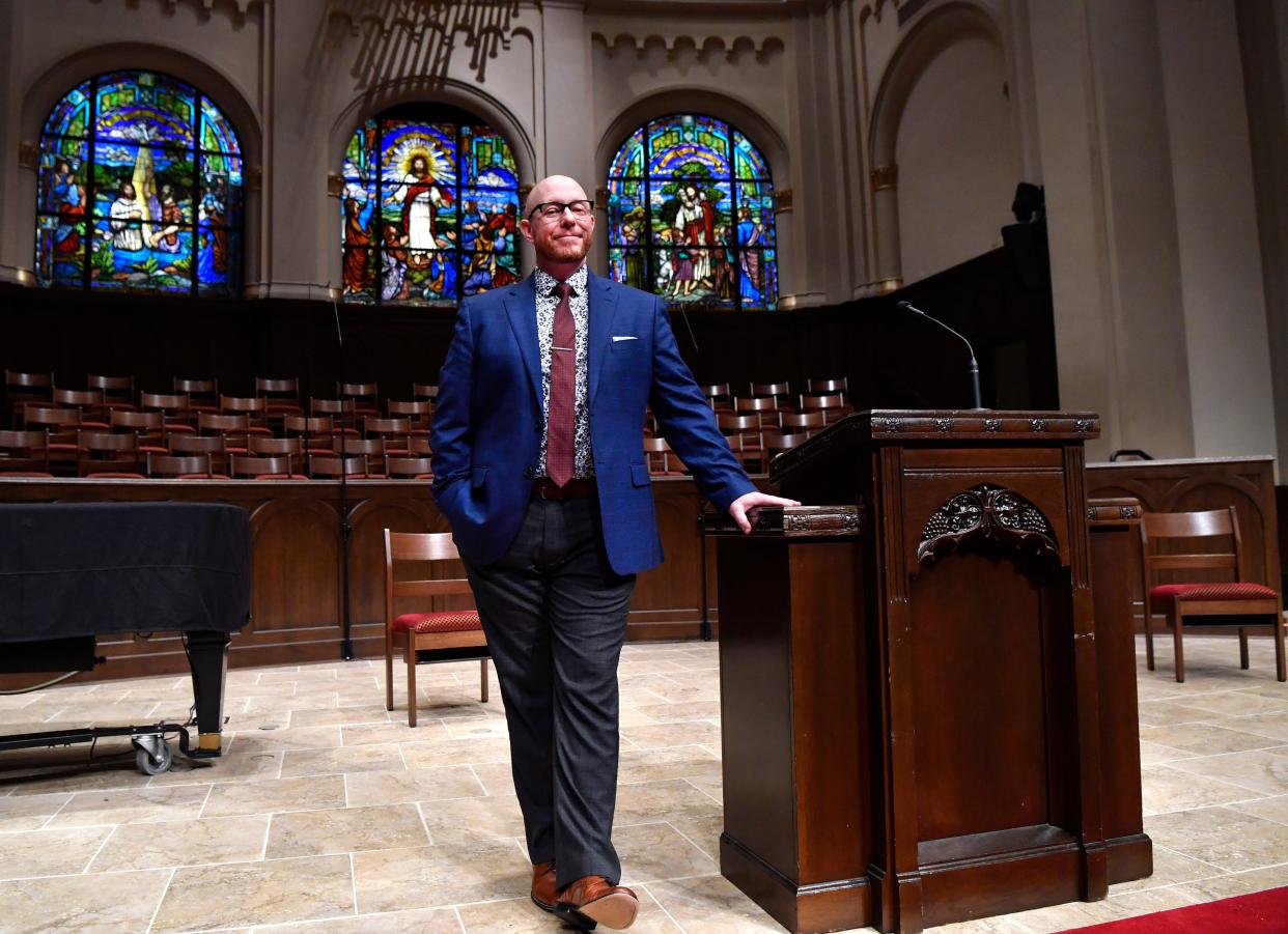 Brandon Hudson stands at the pulpit of Abilene First Baptist Church. Hudson took over for Phil Christopher, who retired after 26 years as pastor, in 2021. Hudson will preaching his first Easter Sunday sermon as pastor of the downtown church.