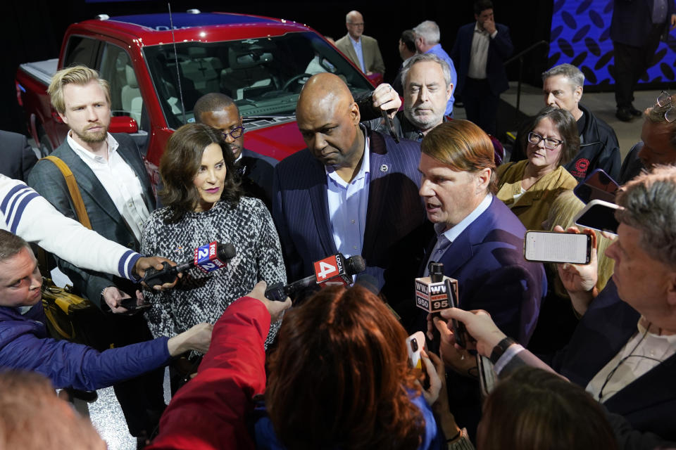 Ford Motor Co., President and CEO Jim Farley, right, addresses the media alongside UAW President Ray Curry, center, and Mich. Gov. Gretchen Whitmer, left, Monday, Feb. 13, 2023, in Romulus, Mich. The automaker plans to build a $3.5 billion electric vehicle battery plant about 100 miles west of Detroit that would employ about 2,500 people. The plant was revealed Monday at a meeting of the Michigan Strategic Fund, which approved a large state tax incentive package for the project near the city of Marshall. (AP Photo/Carlos Osorio)