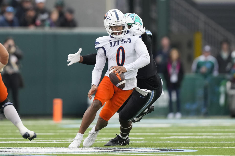 UTSA quarterback Frank Harris (0) is sacked by Tulane defensive lineman Keith Cooper Jr. in the first half of an NCAA college football game in New Orleans, Friday, Nov. 24, 2023. (AP Photo/Gerald Herbert)