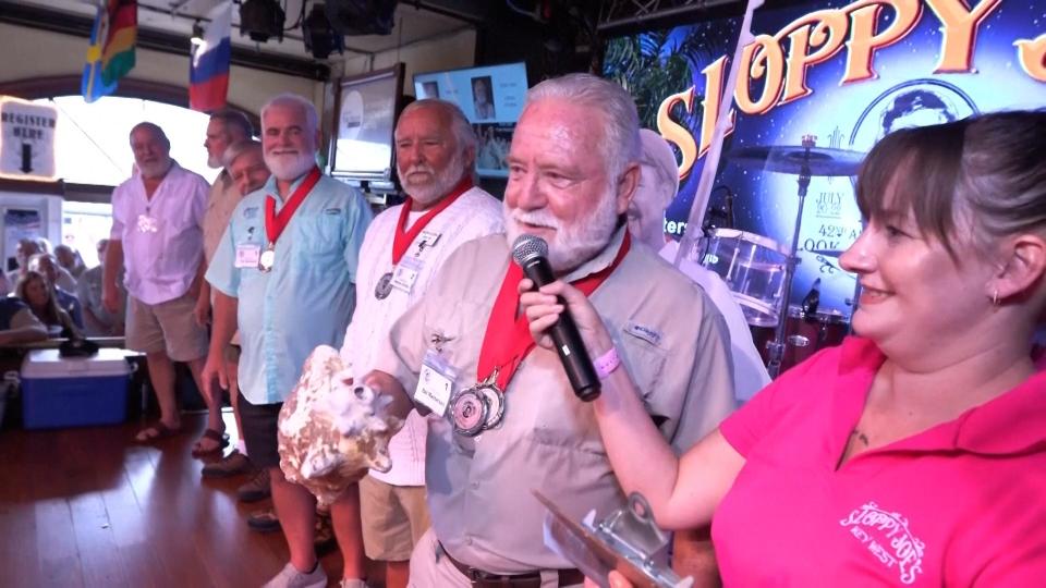 Contestants in Key West, Florida, compete in a look-alike contest during an annual festival celebrating author Ernest Hemingway, who lives on the island in the 1930s.