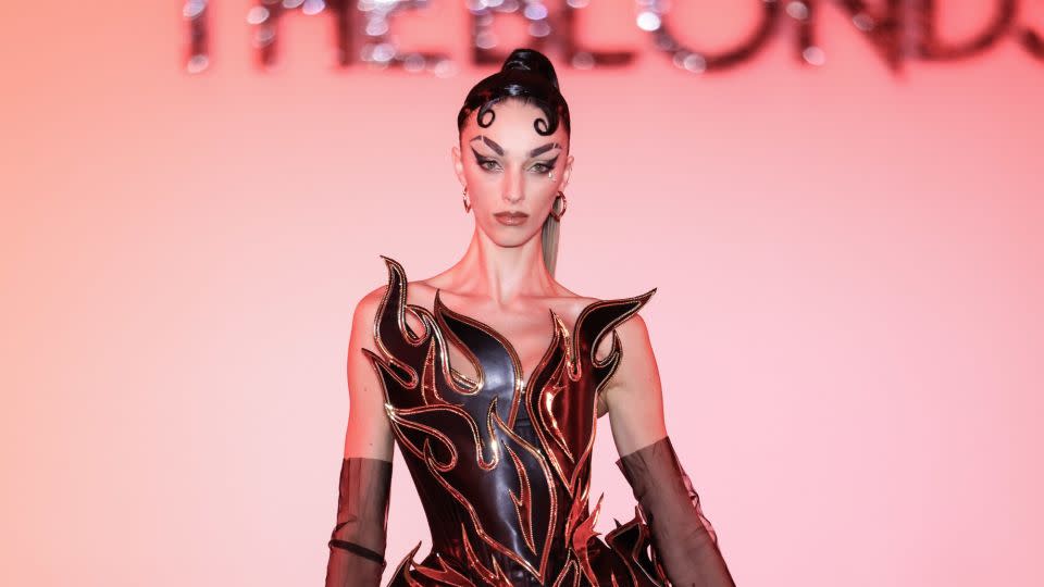 Across lustrous textiles, sparkling jewels and sinuous silhouettes, the collection showcased fire as an embodiment of "renewal, and reinventing your identity," David Blond told CNN. - Thomas Concordia/WireImage/Getty Images
