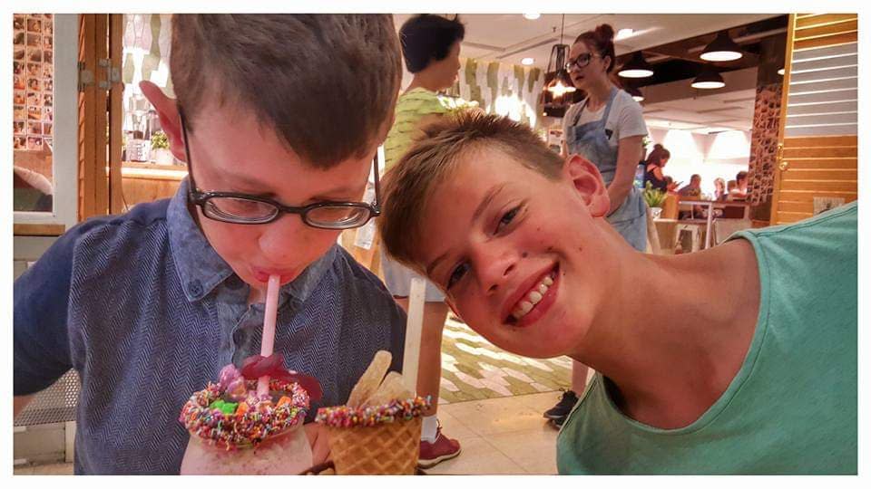 Owen Evans pictured with his brother Joel enjoying a treat together.