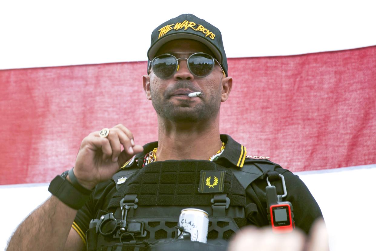 In this Sept. 26, 2020 photo, Proud Boys leader Henry "Enrique" Tarrio wears a hat that says The War Boys during a rally in Portland, Ore. (AP Photo/Allison Dinner, File)