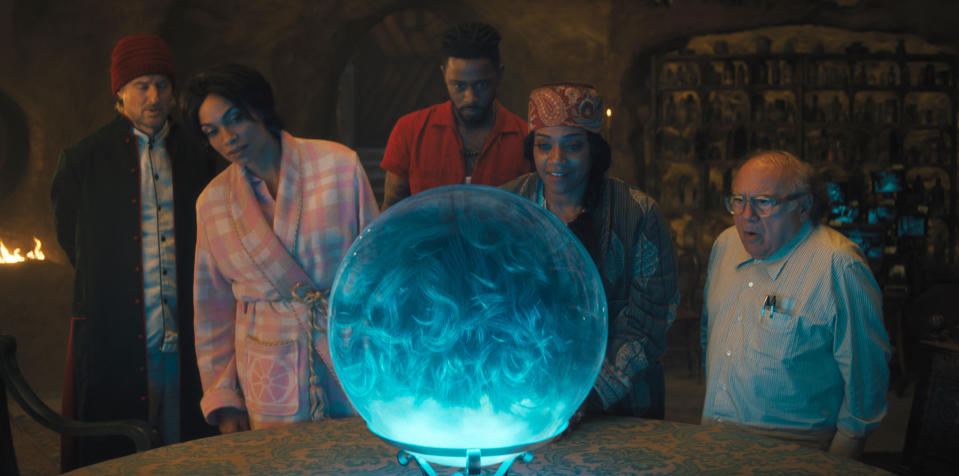 This image released by Disney Enterprises shows, from left, Owen Wilson, Rosario Dawson, LaKeith Stanfield, Tiffany Haddish and Danny DeVito in a scene from "Haunted Mansion." (Disney Enterprises via AP)