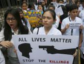 <p>Students from St. Paul’s University, a Roman Catholic university, display placards as they come out from their campus to protest the killings being perpetrated in the unrelenting “War on Drugs” campaign of President Rodrigo Duterte Friday, Sept. 30, 2016 in Manila, Philippines. (AP Photo/Bullit Marquez) </p>