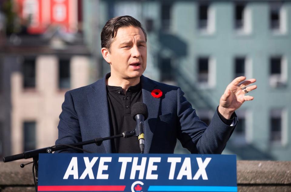 Conservative Leader Pierre Poilievre holds a press conference regarding his “Axe the Tax” message from the roof of a parking garage in St. John’s on Friday, Oct. 27, 2023.