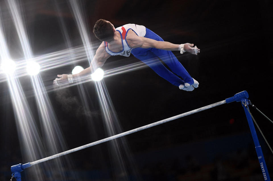 <p>Russia's David Belyavskiy competes in the horizontal bars event of the artistic gymnastics men's team final on July 26.</p>