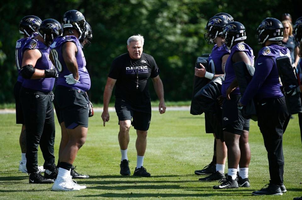 Baltimore Ravens offensive line coach Joe D'Alessandris instructs his players during a recent practice.