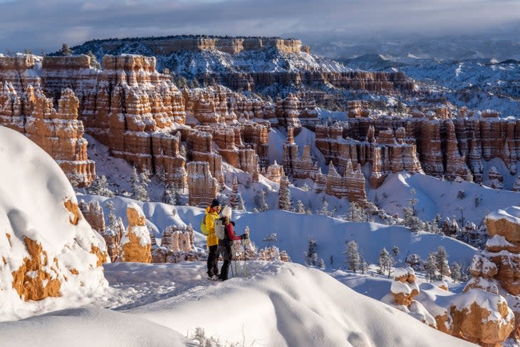 Skiers take in the winter view in Bryce Canyon National Park