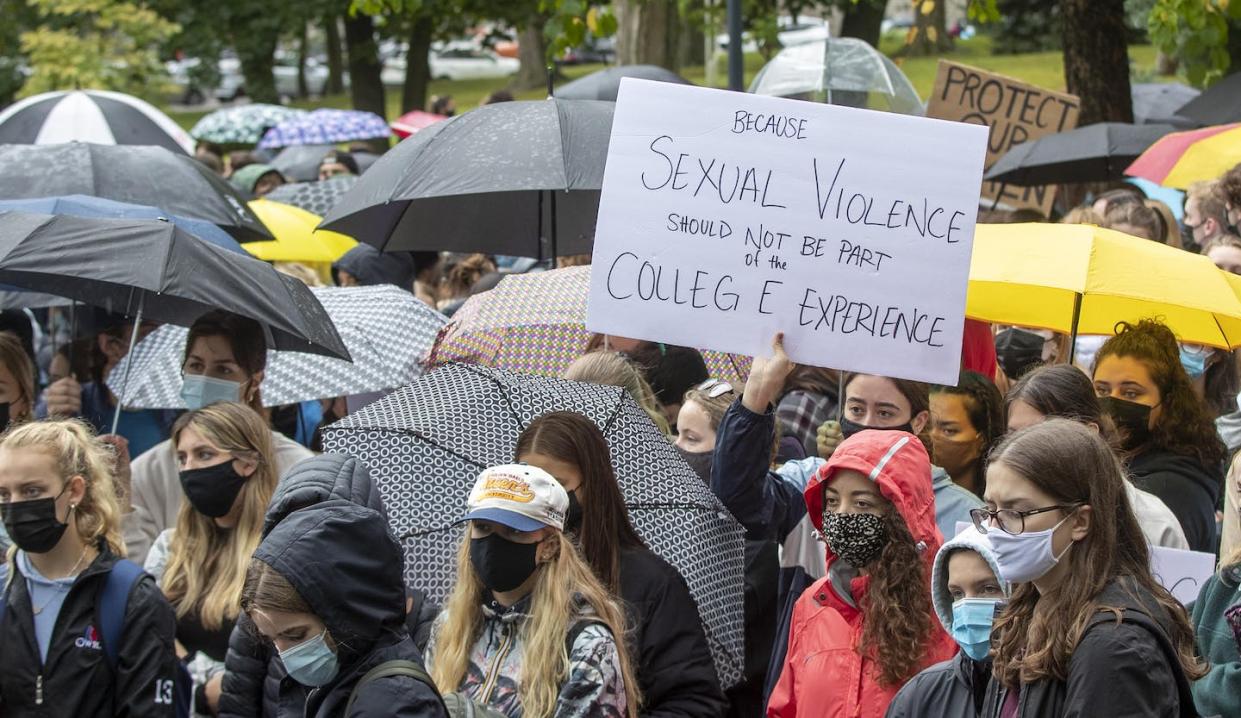 Students organize a walkout to protest sexual violence on campuses and to support survivors of sexual assault in Kingston, Ont., at Queen's University, in September 2021. THE CANADIAN PRESS/Lars Hagberg