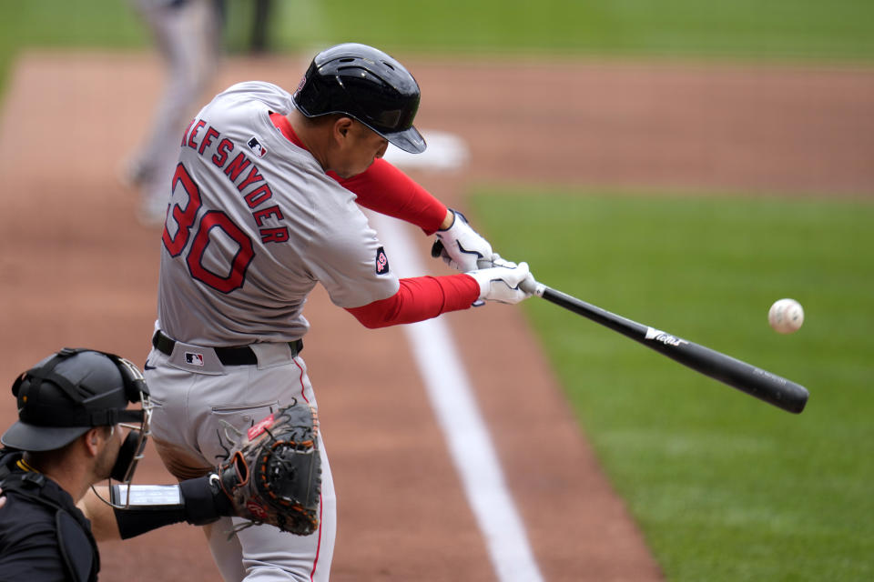 Boston Red Sox's Rob Refsnyder (30) doubles off Pittsburgh Pirates starting pitcher Martín Pérez, driving in a run, during the third inning of a baseball game in Pittsburgh, Sunday, April 21, 2024. (AP Photo/Gene J. Puskar)