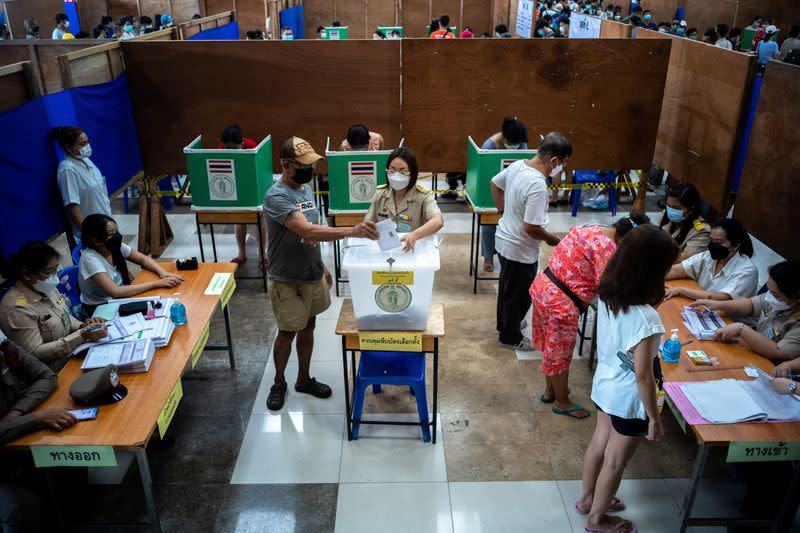 People cast their early vote for the upcoming Thailand's general election at a polling station in Bangkok