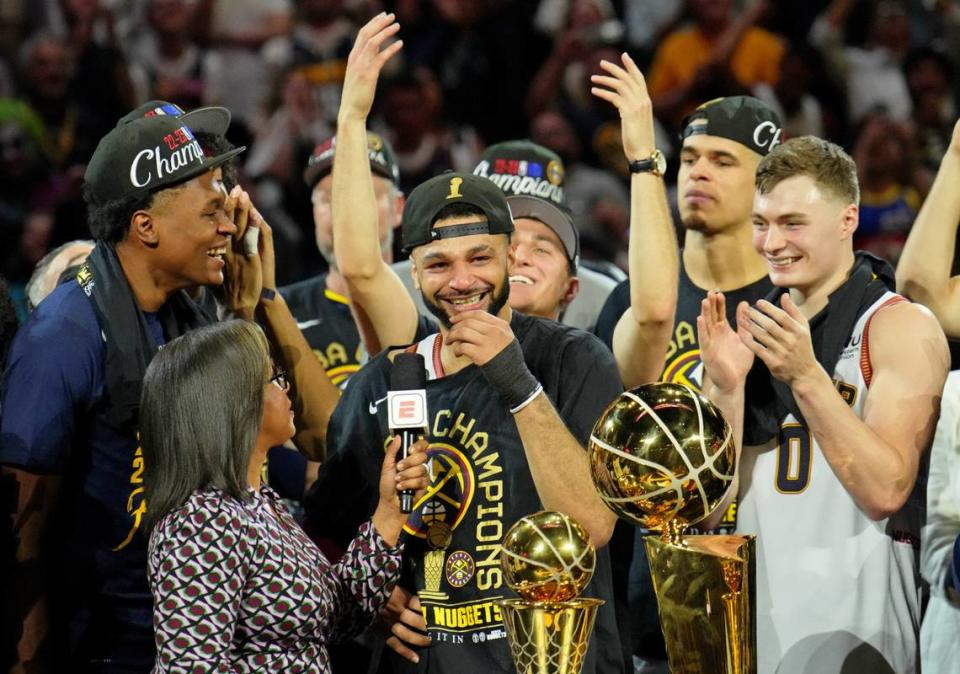 Denver Nuggets guard Jamal Murray, center, chokes up while being interviewed after his team won the NBA championship on June 12. He’s the second John Calipari-coached player to win an NBA title.