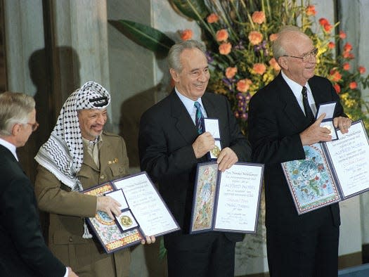 Yasser Arafat, Shimon Peres and Yitzhak Rabin