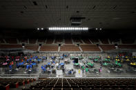 Maricopa County ballots cast in the 2020 general election are examined and recounted by contractors working for Florida-based company, Cyber Ninjas, Thursday, May 6, 2021 at Veterans Memorial Coliseum in Phoenix. The audit, ordered by the Arizona Senate, has the U.S. Department of Justice saying it is concerned about ballot security and potential voter intimidation arising from the unprecedented private recount of the 2020 presidential election results. (AP Photo/Matt York, Pool)