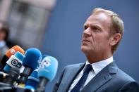 European Council President Donald Tusk talks to the press as he arrives before an EU summit meeting on June 28, 2016