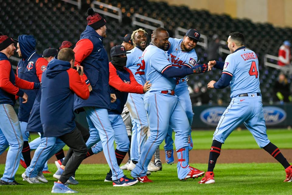 Twins first baseman Miguel Sano, third from right, celebrates with teammates after Sano hit a single during the ninth inning of the Tigers' 5-4 loss on Tuesday, April 26, 2022, in Minneapolis.