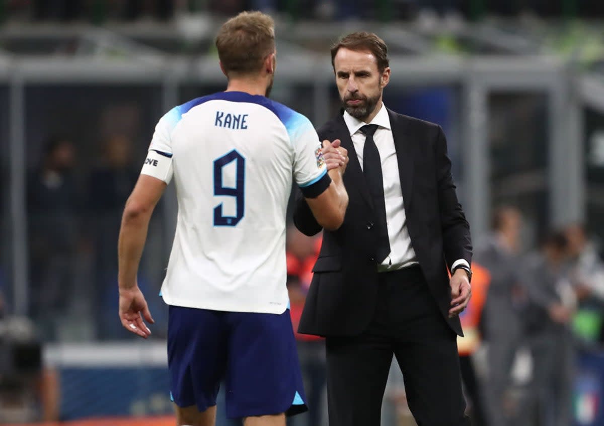 Harry Kane shakes hands with Gareth Southgate at the end of the game in Italy on Friday  (Getty Images)