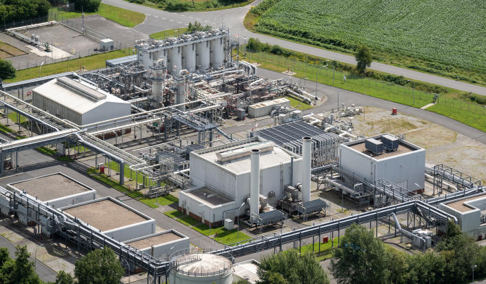 An oil and gas storage facility is seen from the air.