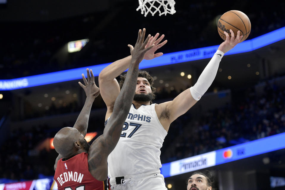 Memphis Grizzlies guard David Roddy shoots the bal against Miami Heat center Dewayne Dedmon in the first half of an NBA basketball game, Monday, Dec. 5, 2022, in Memphis, Tenn. (AP Photo/Brandon Dill)