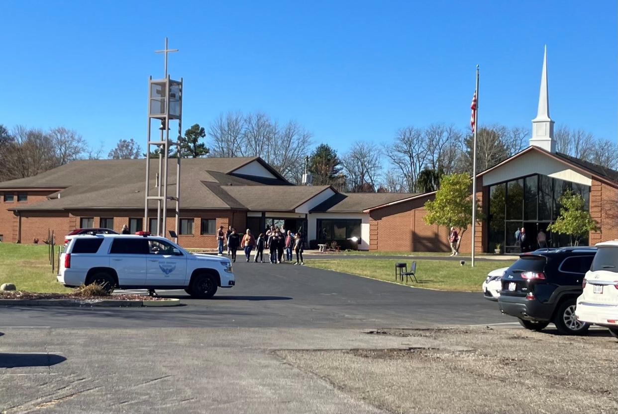 Families gather to reunite Tuesday at the Etna United Methodist Church after a bus crash on Interstate 70, near State Route 310.