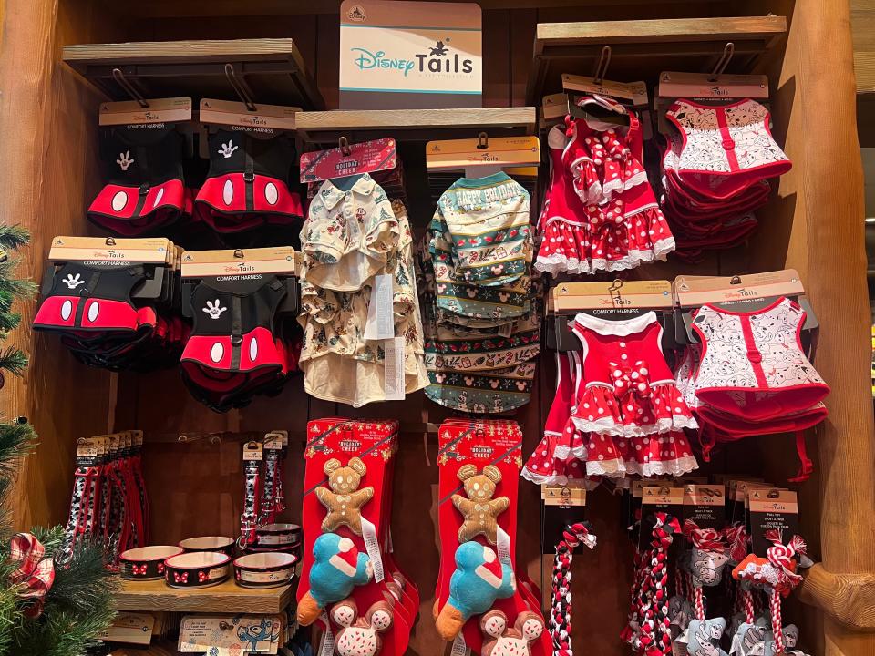 dog toys and dog clothes on shelves at disneyland