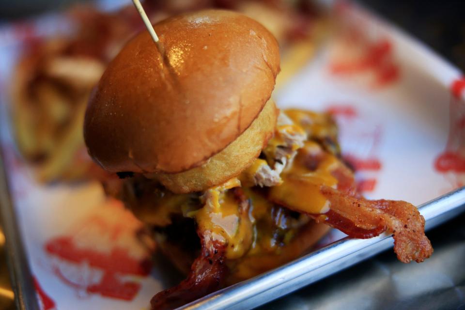 A Tar Heel burger is shown at Carolina Jax in Jacksonville's historic Riverside neighborhood. After three years as a 6x12 trailer food truck, the restaurant put down roots in June 2020 in the location in the former Stuffed Beaver site.