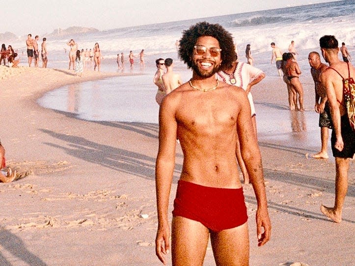 Malik Peay standing on a beach in Rio de Janeiro Brazil freelancer