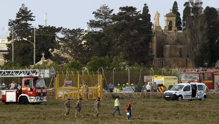 Emergency crews rush to the scene of the crash which killed five. Photo: AP