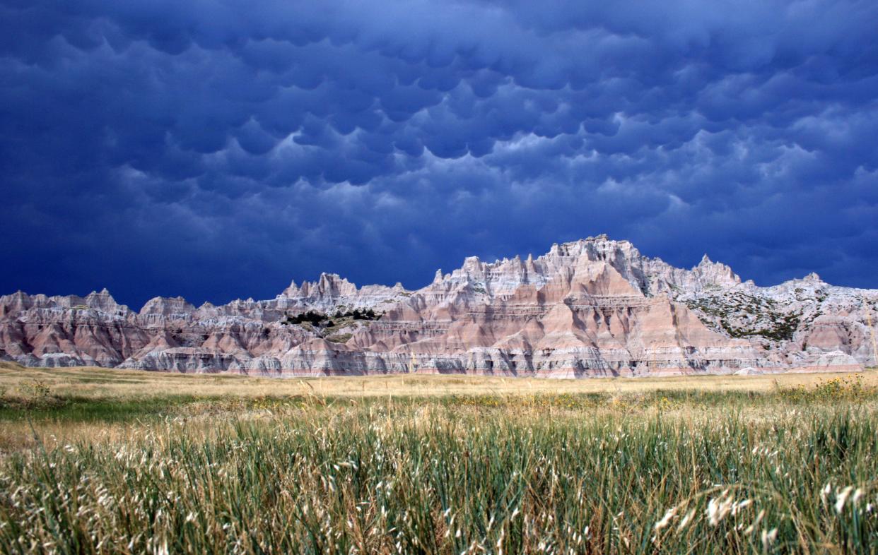 Dramatic clouds are seen over Badlands National Park.