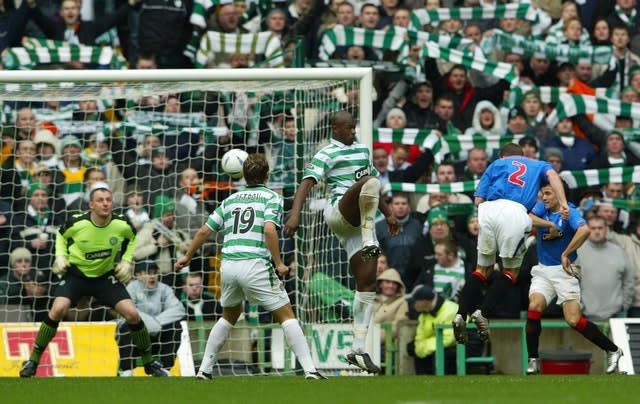 Fernando Ricksen heads home in an Old Firm derby 