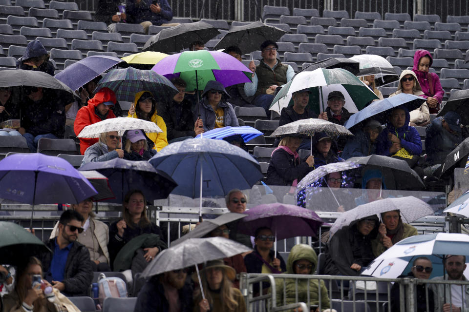 The crowd shelter under umbrellas as the rain delays play on day one of the cinch Championships at The Queen's Club, London. Picture date: Saturday June 15, 2024. (Photo by Jordan Pettitt/PA Images via Getty Images)