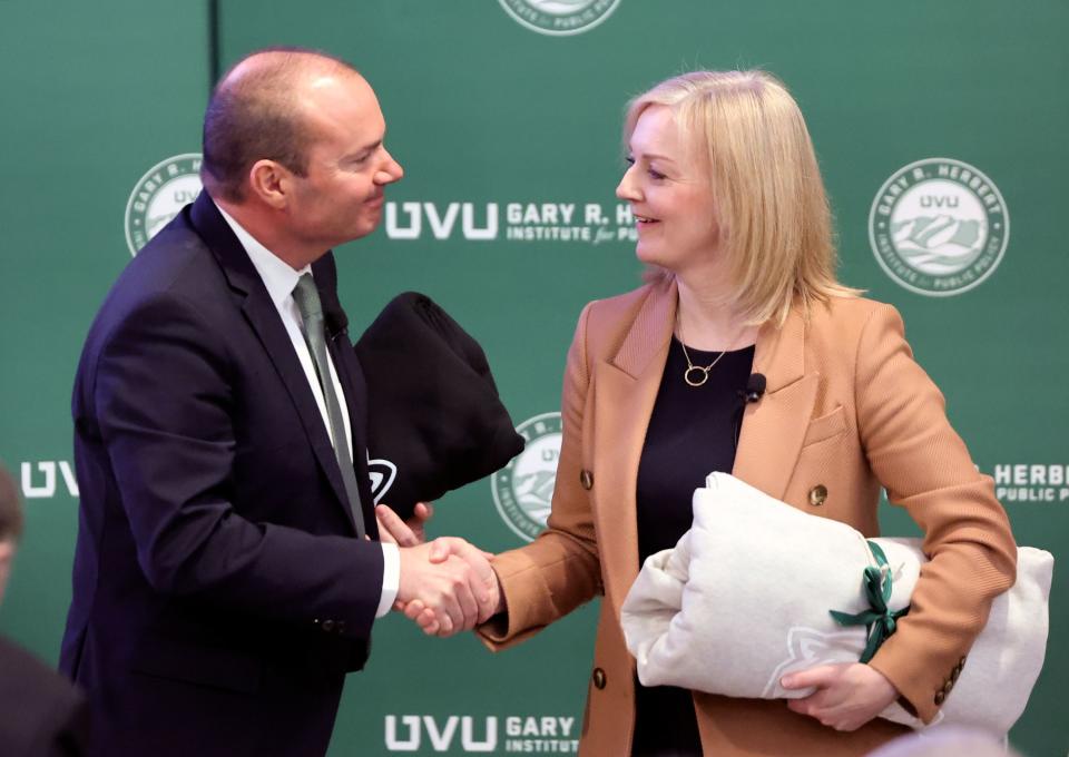 Sen. Mike Lee, R-Utah, and former British Prime Minister Liz Truss shake hands after talking about “The Importance of the U.S.-U.K. Bilateral Relationship” during a Gary R. Herbert Institute for Public Policy Forum at Utah Valley University in Orem on Tuesday, Feb. 20, 2024. | Kristin Murphy, Deseret News