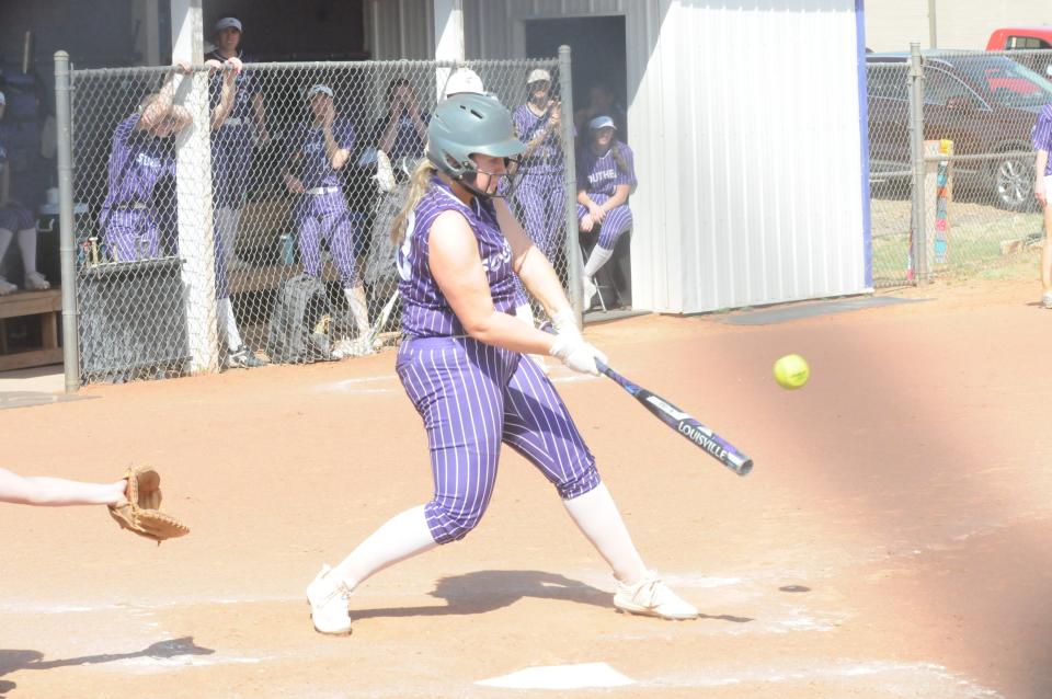 Southeast of Saline's Chase Gilpin (00) swings at a pitch during Tuesday's doubleheader against Sacred Heart at Southeast of Saline.