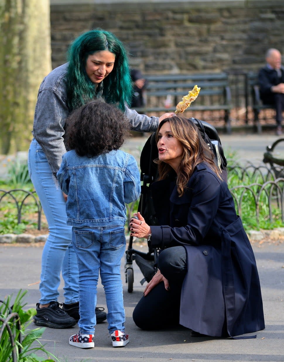 Mariska Hargitay pictured taking a break from filming 'Law and Order: SVU' to help a crying child