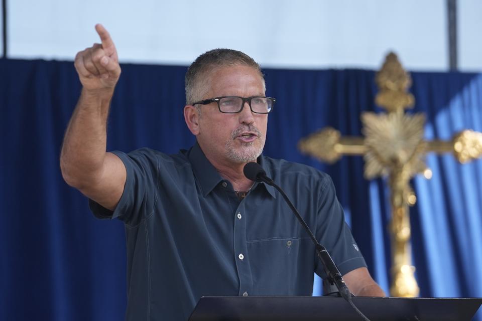 Jim Caviezel speaks during a "rosary rally" on Sunday, Aug. 6, 2023, in Norwood, Ohio. A national religious organization, Catholics for Catholics, gathered a lineup of anti-abortion influencers and conspiracy theorists from across the U.S. to speak at the rally to urge a “yes” vote on a ballot question in Ohio, known as Issue 1. If voters approve Issue 1, it would make it more difficult for an abortion rights amendment on the November ballot to succeed. (AP Photo/Darron Cummings)