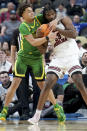 Oregon's Jadrian Tracey, left, and South Carolina's Josh Gray, right, fight for a rebound during the first half of a first-round college basketball game in the NCAA Tournament, Thursday, March 21, 2024, in Pittsburgh. (AP Photo/Matt Freed)