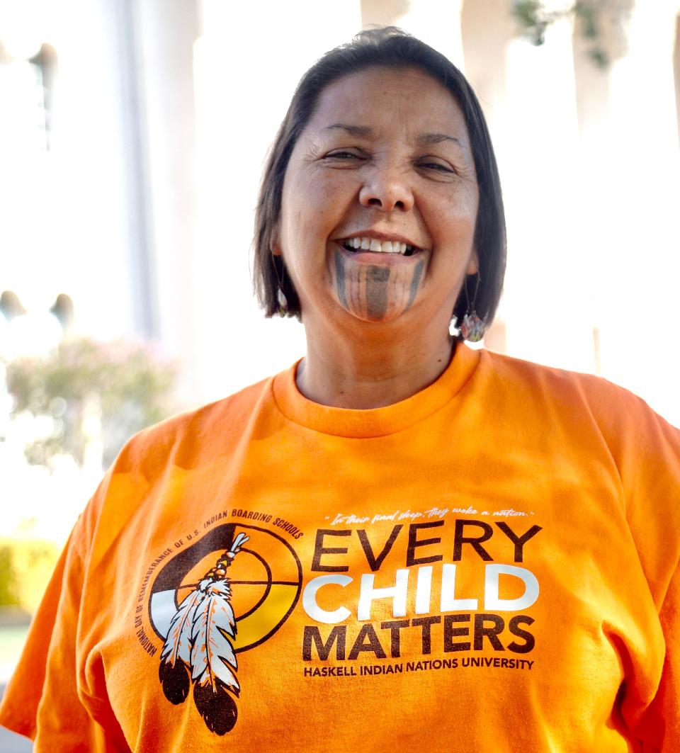 Native American education specialist April Carmelo wears a T-shirt recognizing the National Day of Remembrance for Indian Boarding Schools, observed Sept. 30.