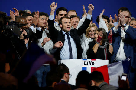 Emmanuel Macron, head of the political movement En Marche !, or Forward !, and candidate for the 2017 French presidential election, sings the French national anthem at the end of a political rally in Lille, France January 14, 2017. REUTERS/Pascal Rossignol