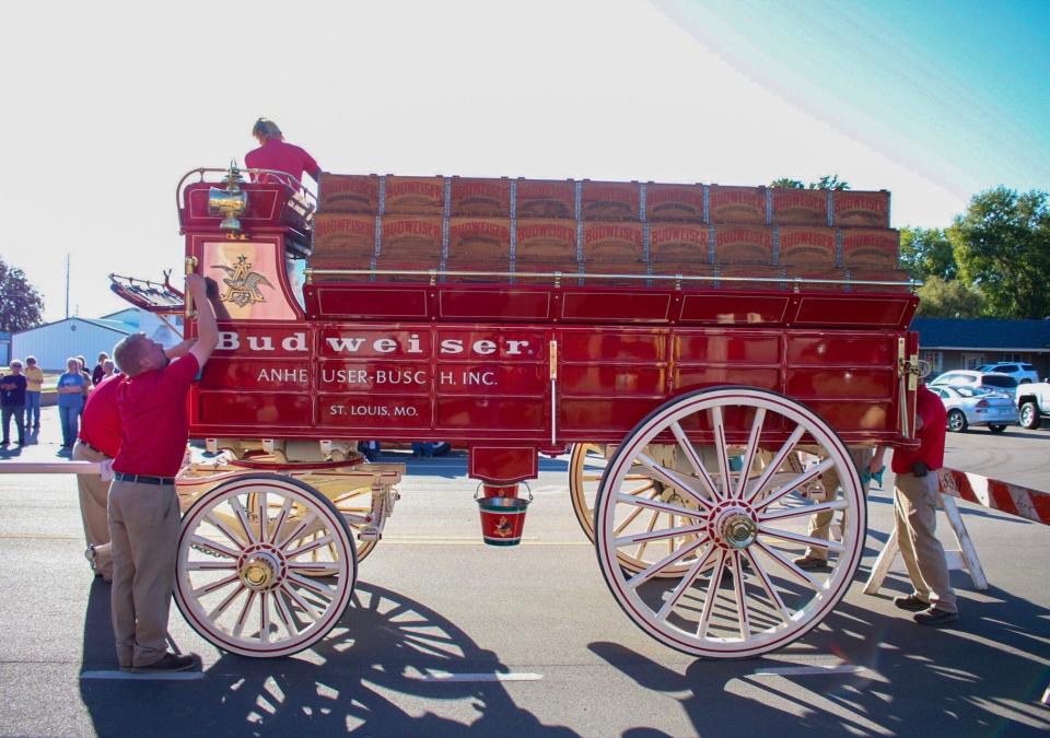 Members of the Budweiser team clean and prepare the hitch.