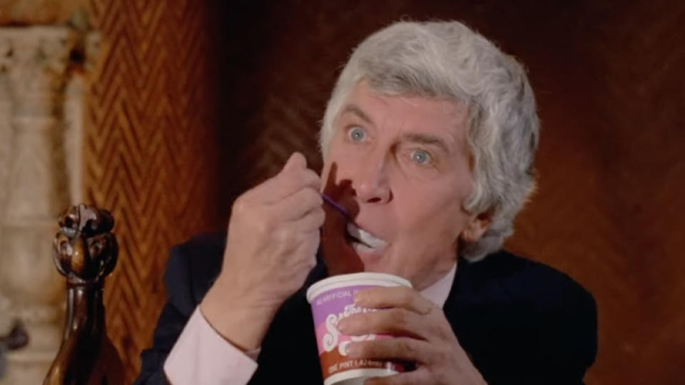 Patrick O'Neal as Fletcher enjoying a big bite of The Stuff